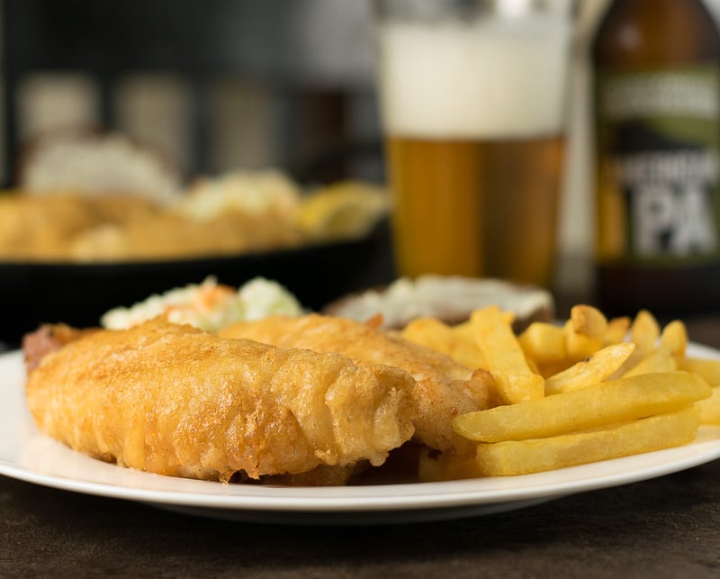 Beer battered perch recipe with french fries, coleslaw, and rye bread,